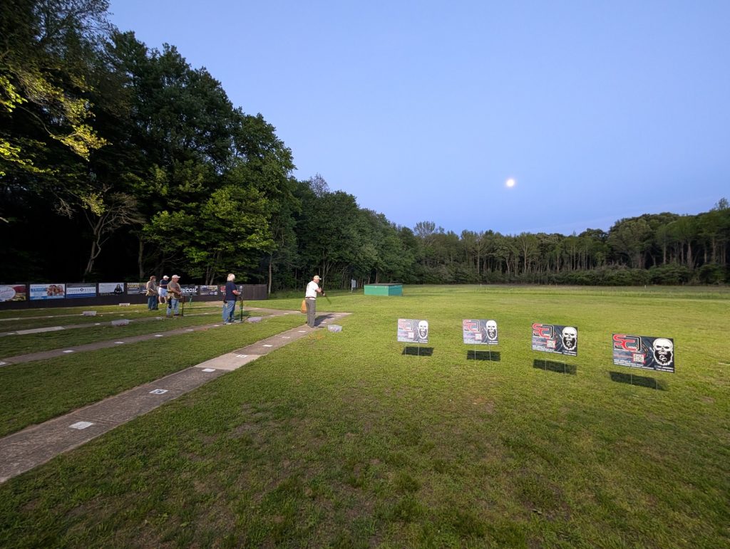 Evening league under the lights, moon rising